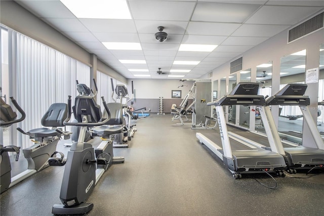 gym featuring a drop ceiling