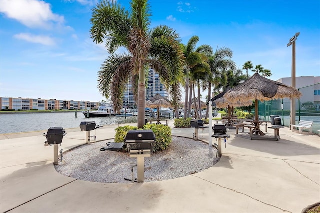 view of community with a gazebo and a water view