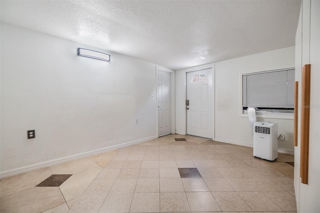 entryway with a textured ceiling