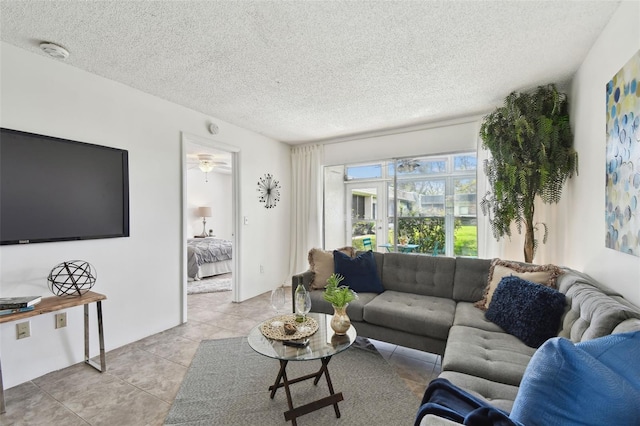 living room featuring a textured ceiling and light tile patterned flooring