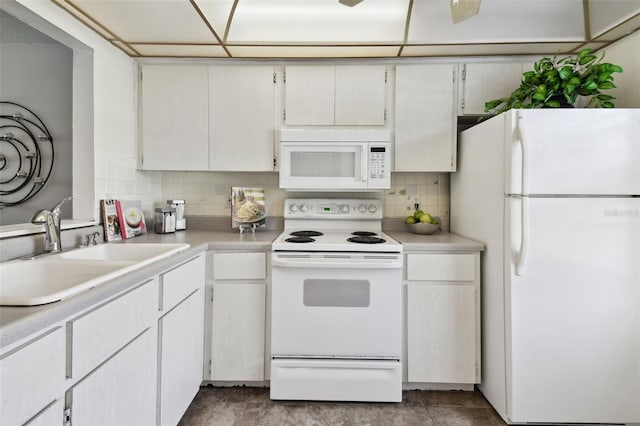 4732 Lake Blvd Unit A, Clearwater, FL 33762 - kitchen with white appliances, light countertops, and decorative backsplash