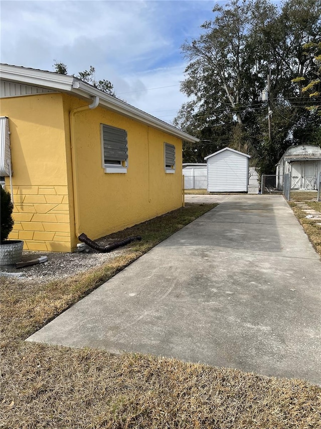 view of home's exterior with a shed