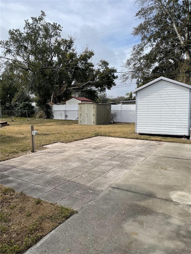 exterior space with a patio and a storage unit