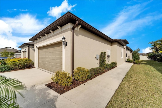 view of home's exterior with a garage and a yard