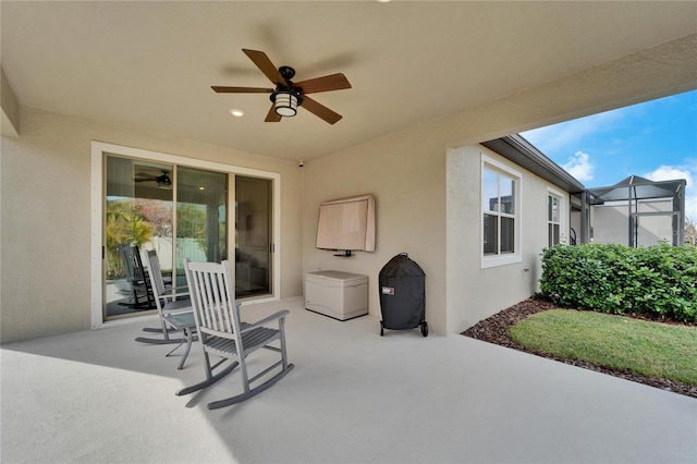 view of patio featuring ceiling fan