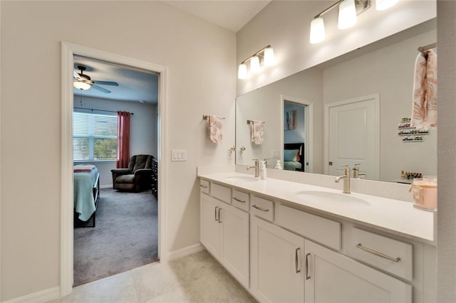 bathroom with ceiling fan, vanity, and tile patterned flooring