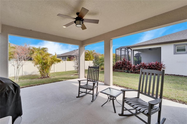 view of patio / terrace featuring ceiling fan, area for grilling, and a fenced backyard