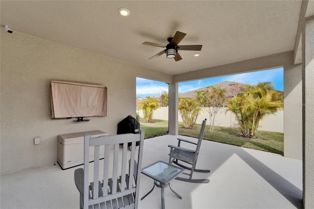 view of patio / terrace with a ceiling fan and a fenced backyard