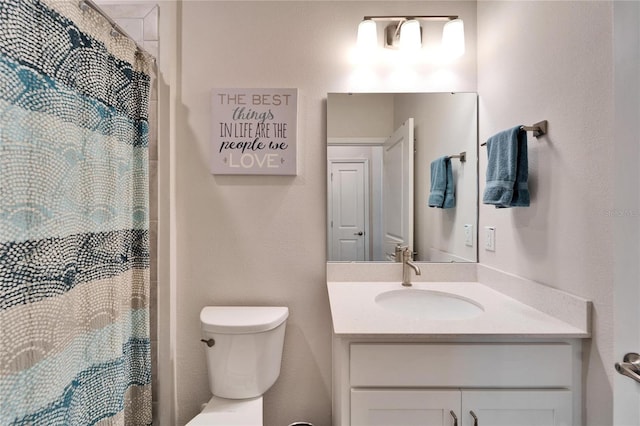 full bath featuring toilet, a shower with shower curtain, and vanity