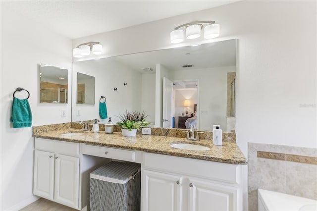 bathroom with vanity and an enclosed shower