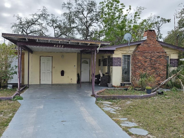 view of front of property with a carport