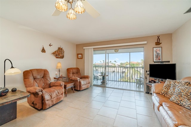 living room with light tile patterned flooring and ceiling fan