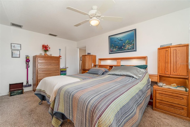 bedroom featuring ceiling fan and light colored carpet