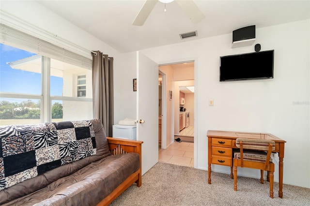 living room featuring ceiling fan and light colored carpet