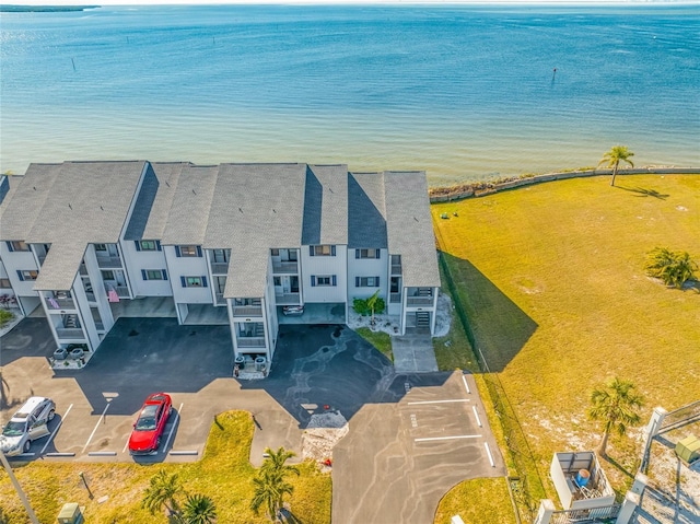 bird's eye view featuring a view of the beach and a water view