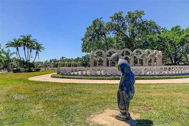 view of property's community with a lawn