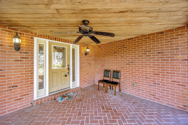 entrance to property featuring ceiling fan