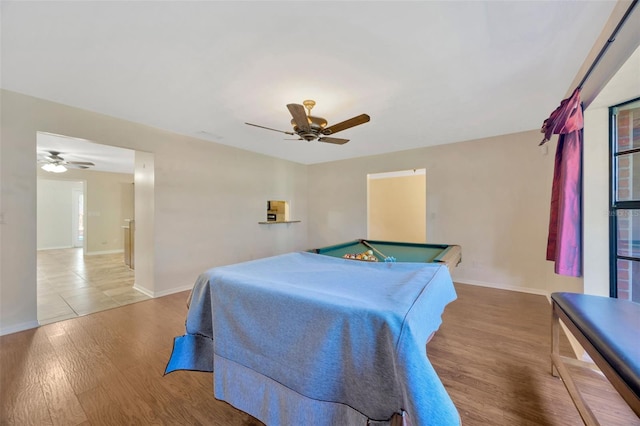 bedroom with ceiling fan, pool table, and light hardwood / wood-style flooring