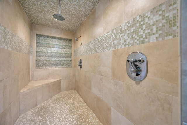 bathroom featuring a tile shower