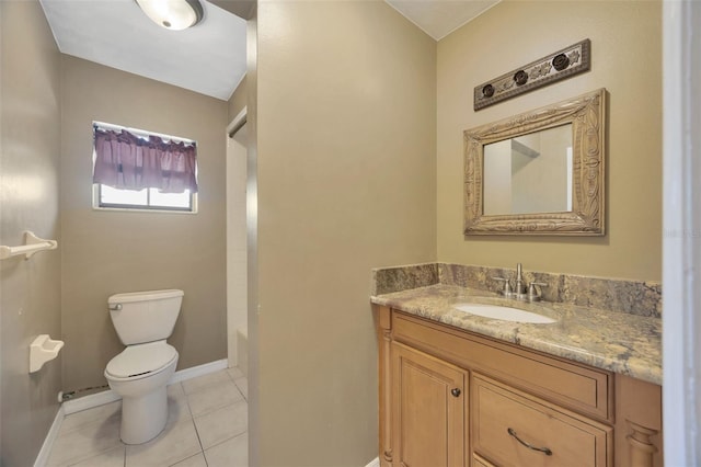 bathroom with tile patterned floors, vanity, toilet, and a bath