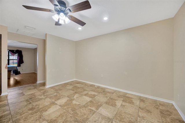 unfurnished room with ceiling fan