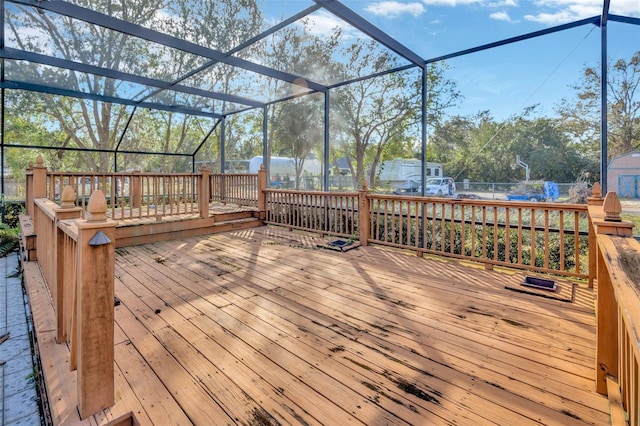 wooden deck featuring glass enclosure