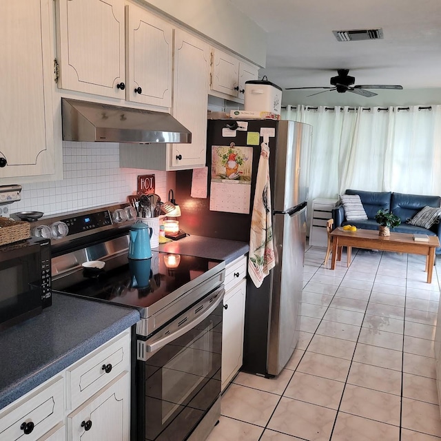 kitchen featuring white cabinetry, decorative backsplash, light tile patterned floors, ceiling fan, and stainless steel appliances