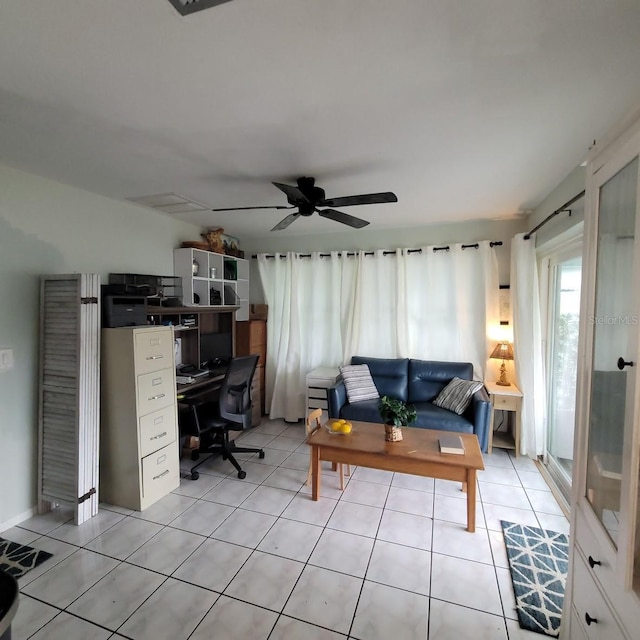 tiled home office featuring ceiling fan