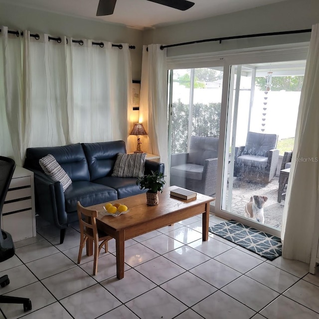 tiled living room featuring ceiling fan