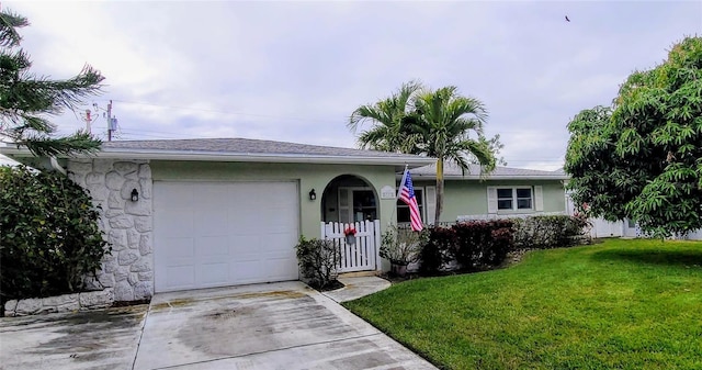 single story home with a garage and a front yard