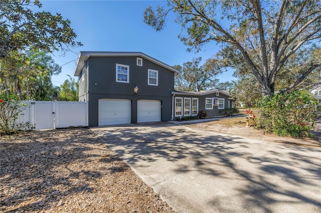 view of side of home with a garage