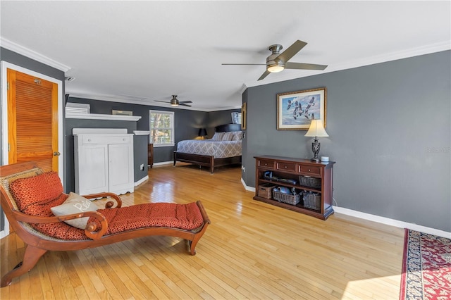 bedroom featuring ornamental molding, ceiling fan, and light hardwood / wood-style floors