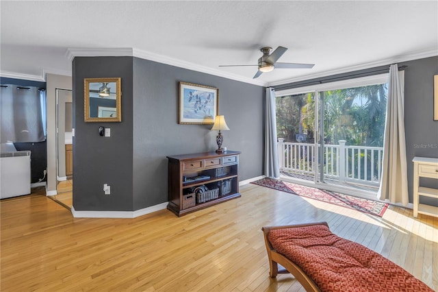 sitting room with crown molding, ceiling fan, and hardwood / wood-style flooring