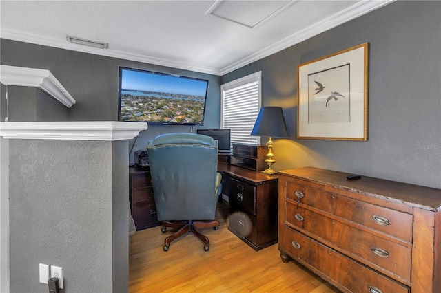 office with crown molding and light hardwood / wood-style floors