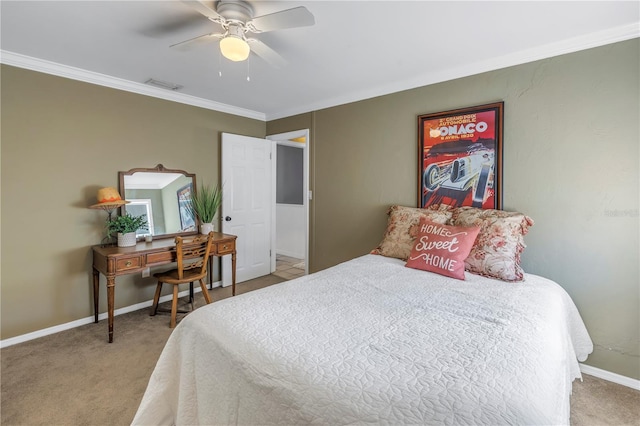 carpeted bedroom featuring crown molding and ceiling fan