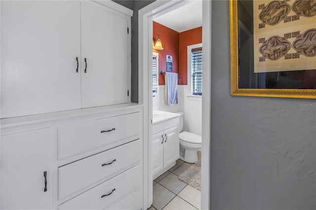 bathroom with tile patterned floors, toilet, and vanity