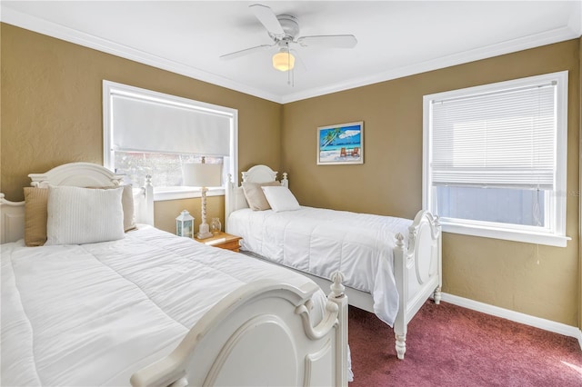 carpeted bedroom with ceiling fan and ornamental molding