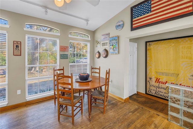 540 Villagrande Ave S, Saint Petersburg, FL 33707 - dining space featuring vaulted ceiling, wood-type flooring, track lighting, and ceiling fan