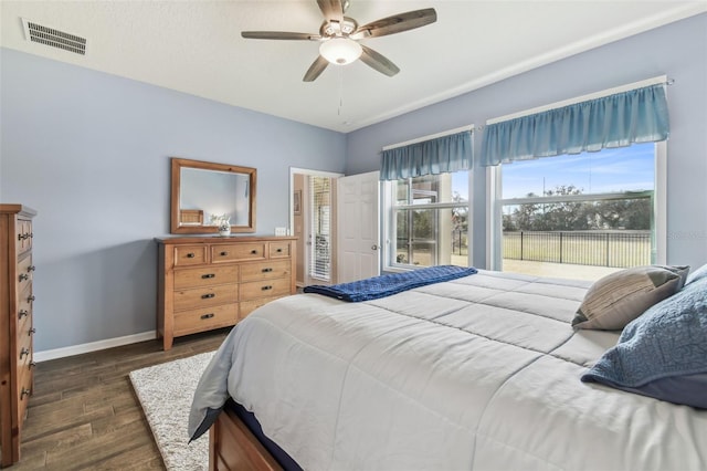 bedroom with ceiling fan and dark hardwood / wood-style flooring