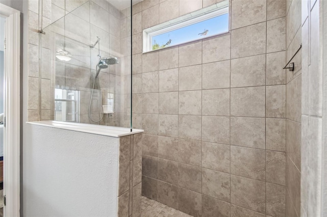 bathroom with tiled shower