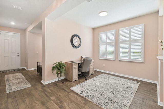 office with dark hardwood / wood-style flooring