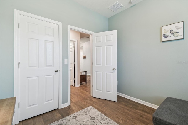 interior space with dark hardwood / wood-style flooring