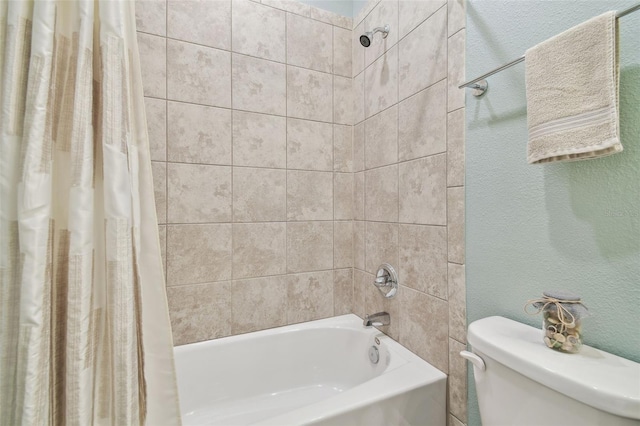 bathroom with shower / bath combination with curtain and toilet