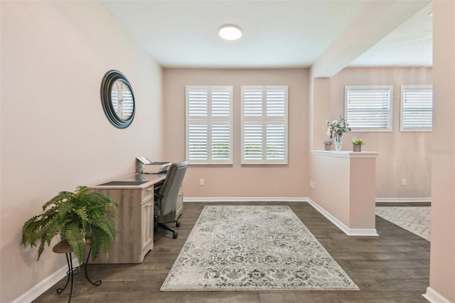 home office with dark wood-type flooring