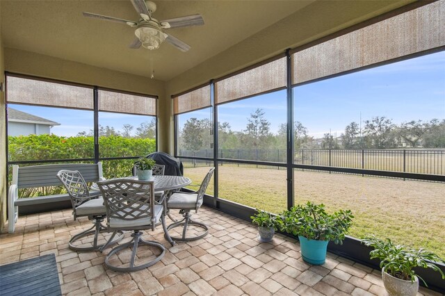 sunroom / solarium with ceiling fan