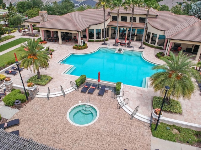 view of swimming pool with a gazebo, a patio area, and an in ground hot tub