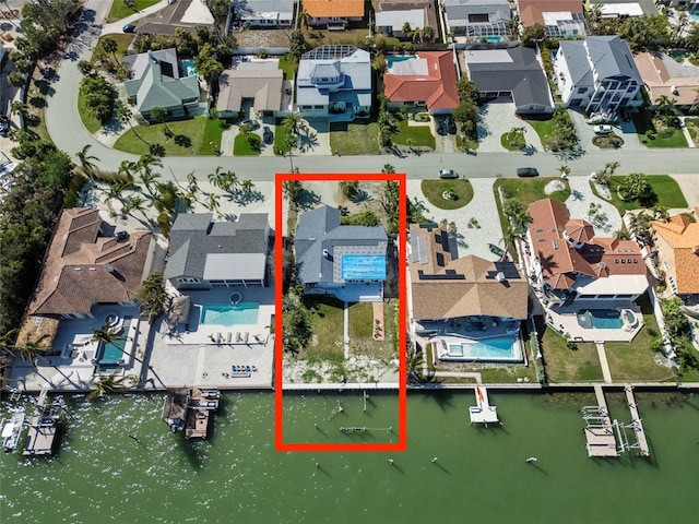 birds eye view of property featuring a water view