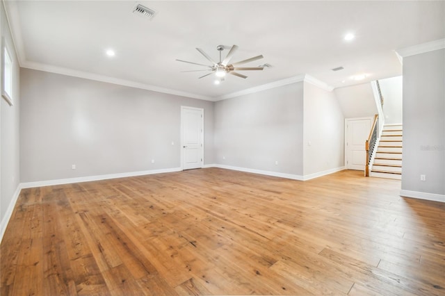 unfurnished room featuring ceiling fan, ornamental molding, and light wood-type flooring