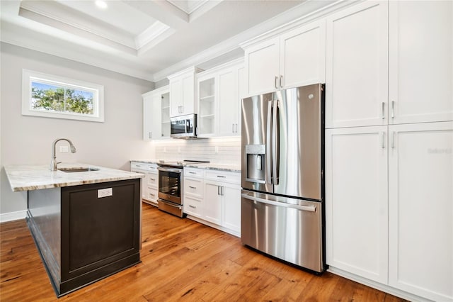 kitchen with sink, ornamental molding, stainless steel appliances, light stone countertops, and white cabinets