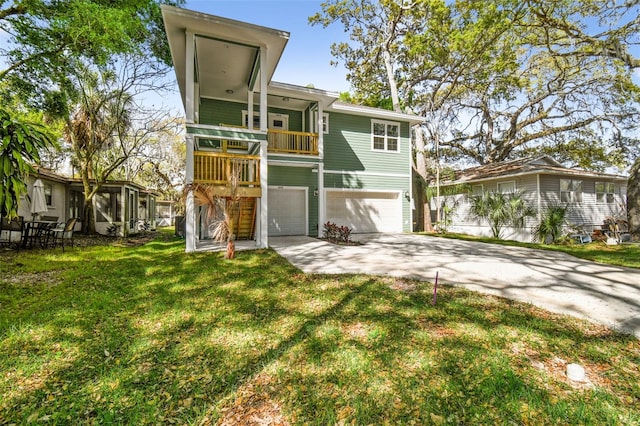 back of property with a garage and a yard